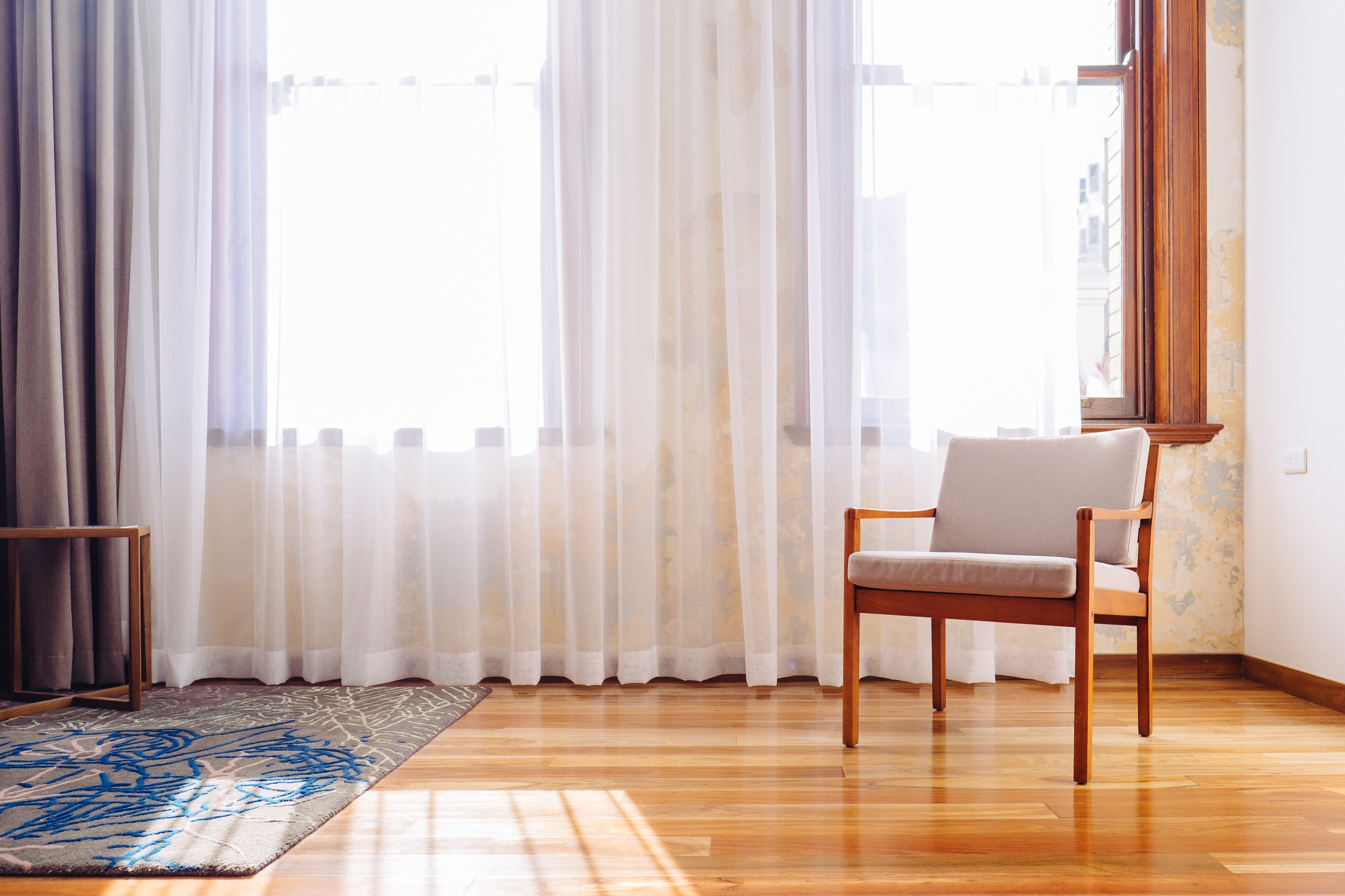 an empty chair sitting in a decorated room